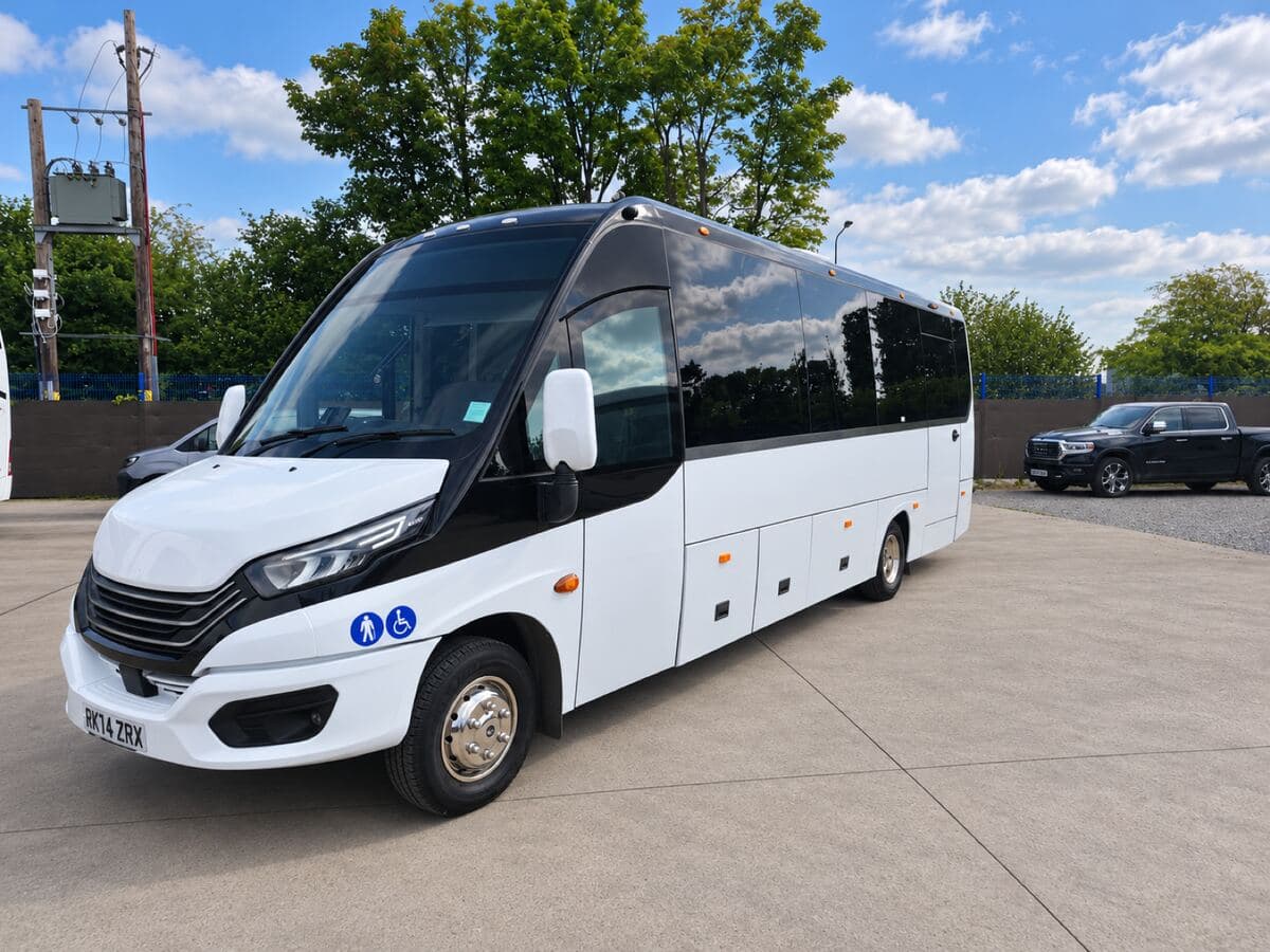 White Iveco midi coach from a partner operator